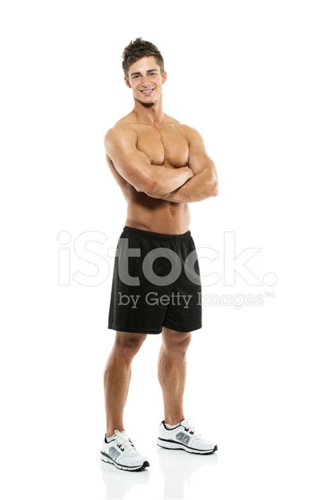 muscular man standing  arms crossed stock photo royalty