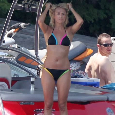 carrie underwood makes a splash in a colourful bikini before taking