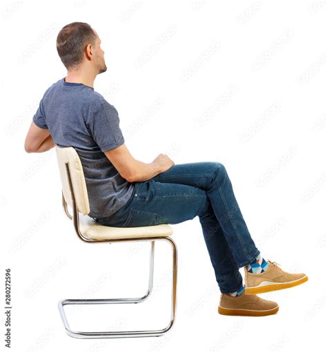 side view   man sitting   chair stock photo adobe stock