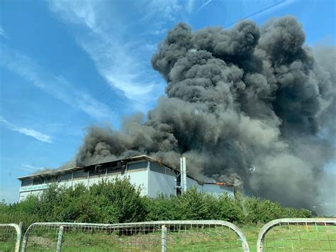 pictures show huge factory fire burning  peterborough