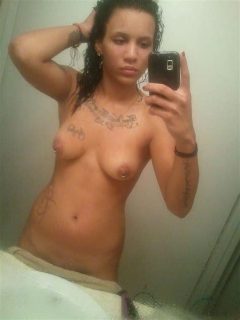 Ebony Coed With Tattoos And Pierced Nipples Takes Nude