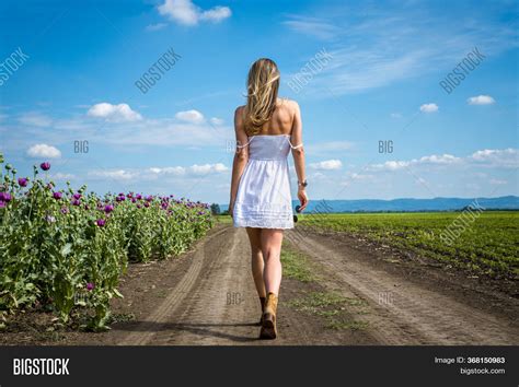 woman walking fields image photo  trial bigstock