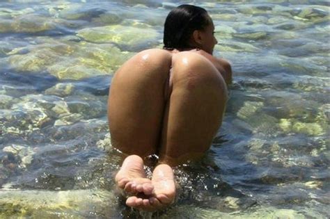 hot amateur big ass posing from behind in nude beach photo
