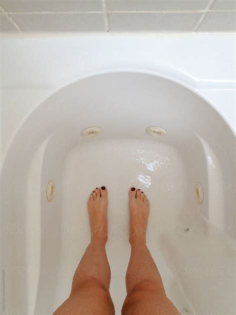 Woman S Legs And Feet Standing In A Wet Bathtub By Holly Clark Legs