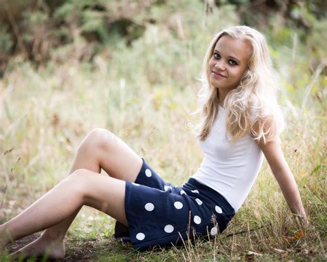 bautiful blond teenage girl alone in the woods stock image