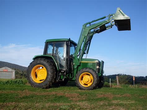 john deere  tractor  front  loader fitted