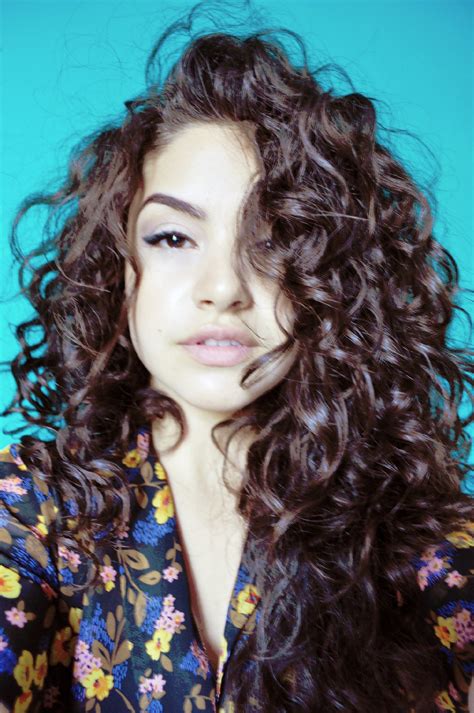 cool hairstyle  dark brown curly hair  highlights