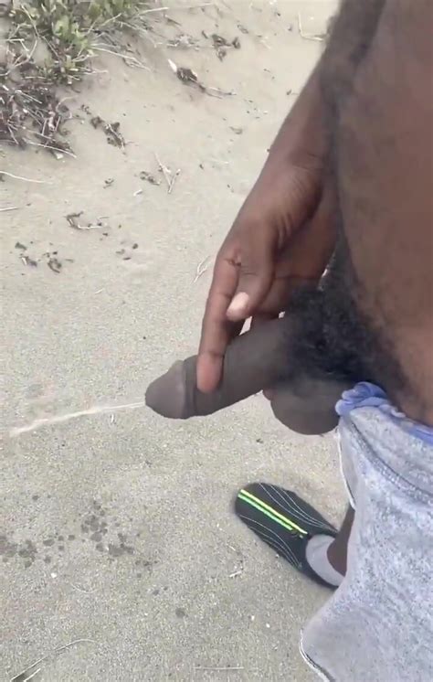 big jamaican dick pissing at a beach