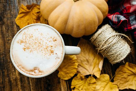 Closeup Pumpkin Spiced Latte Or Coffee In Cup Dry Leaves Ts On A