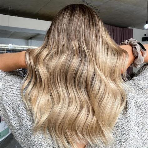 your guide to dark roots on blonde hair wella professionals