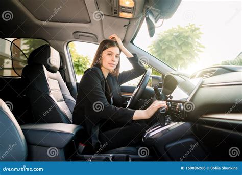 side view  young beautiful business woman sitting   car