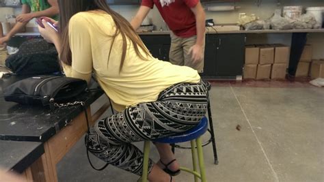 big bubble butt deliciously sits on a stool in the classroom