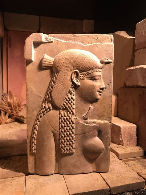 egyptian art cleopatra dressed   goddess isis relief sculpture