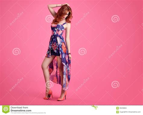 fashion sensual redhead girl summer floral dress stock