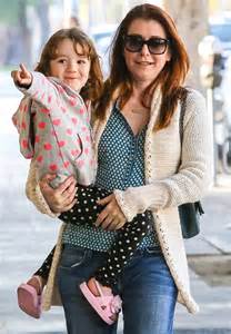 alyson hannigan s three year old daughter satyana takes charge as she feeds the parking meter