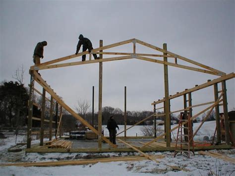 men  working   framing   house  construction  winter time  snow