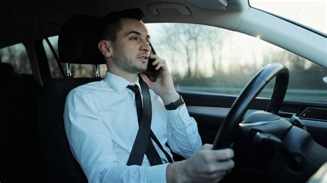 young man driving car talking  phone stock footage sbv