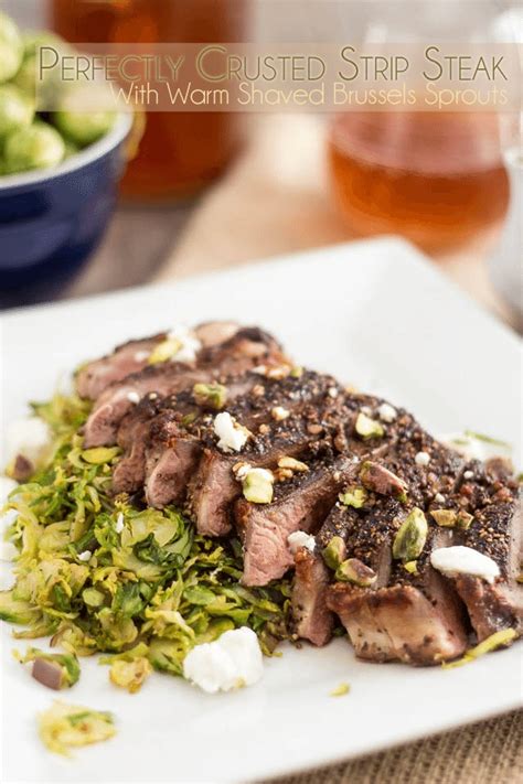crusted strip steak over warm shaved brussels sprouts