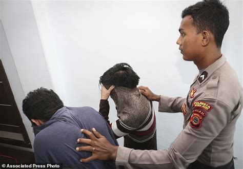 shariah court in indonesia sentences gay couple to caning daily mail