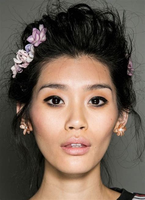 asian prom hairstyle with spikes and hair accessories