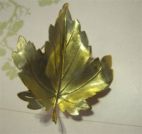 gold plated maple leaf pin