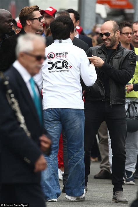 brad pitt gets caught in rain as he prepares to start le mans 24 hours daily mail online