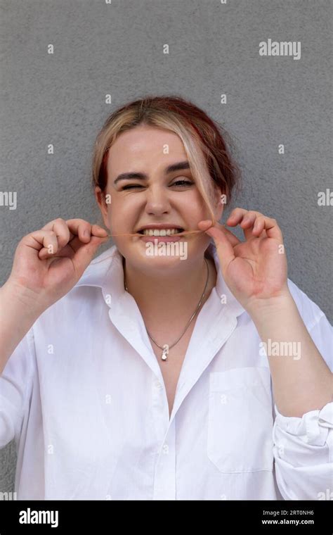 Real Cute 20s Plus Size Pretty Girl Bites Strand Of Hair With Teeth