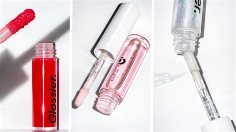 glossier launches lip gloss    shades red  holographic allure