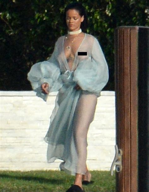 rihanna flashes boobs going topless in see through robe to