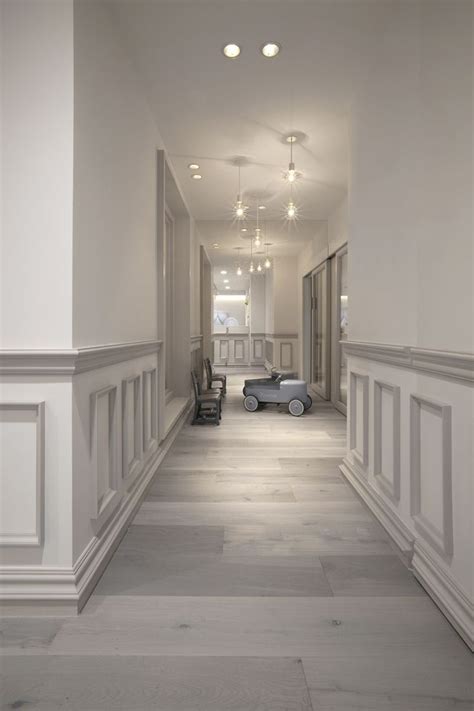 muted grey white toned wainscoting adds  world charm   modern