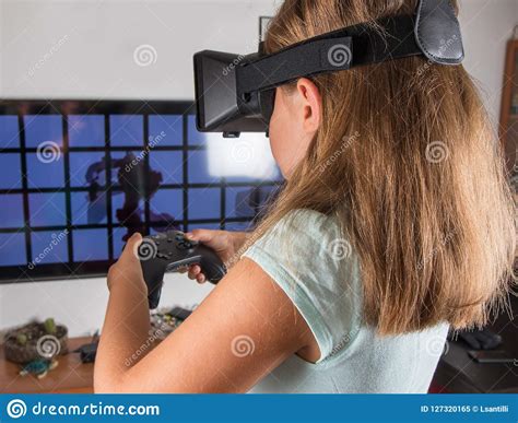 Happy Woman With Virtual Reality Headset And Joystick