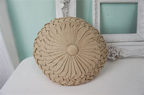 this thick round toss pillow is made from what i believe is silk in a