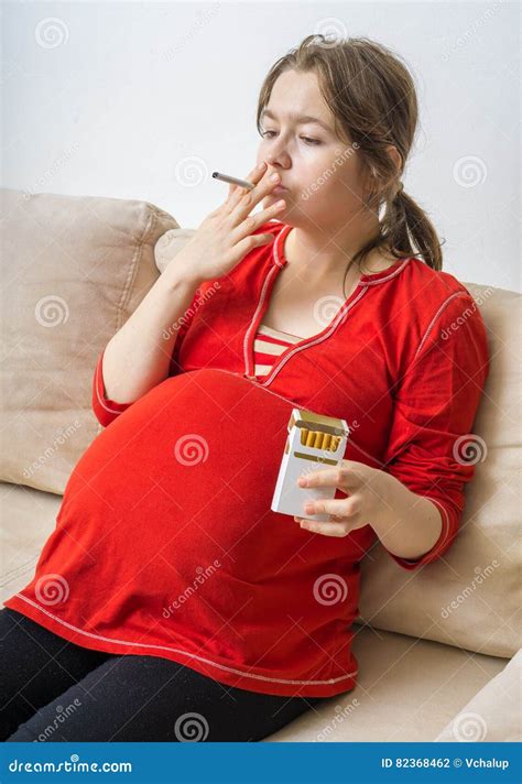 Smoking In Pregnancy Pregnant Woman Holds Cigarette In Hand Stock