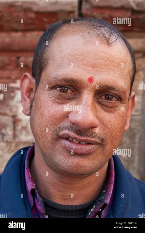 kathmandu nepal nepali man wears  tikka   forehead  red mark
