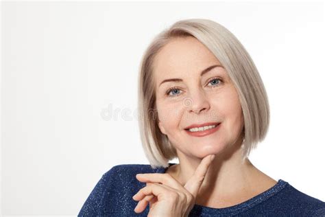 Attractive Middle Aged Woman With Folded Arms On White Background Stock