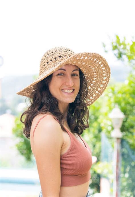 Portrait Of Beautiful Smiling Woman In Wide Brim Straw Hat Stock Image