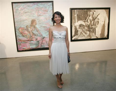 woman standing  front   paintings  display   art gallery