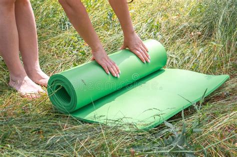 woman on yoga mat to relax in park stock image image of