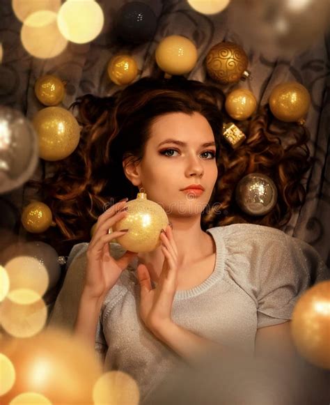The Girl Celebrates New Year And Christmas She Is Holding A Large Ball