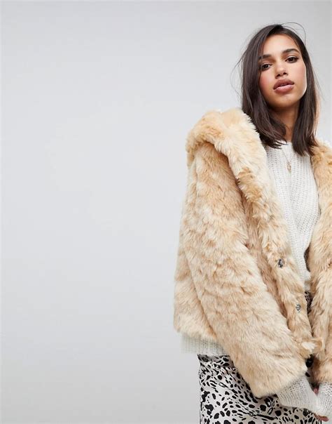 asos hooded fluffy faux fur coat selena gomez wears fuzzy jacket  popsugar fashion photo
