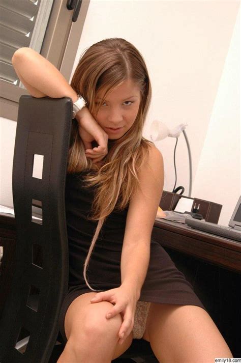 emily 18 wearing a sexy black dress in the office coed