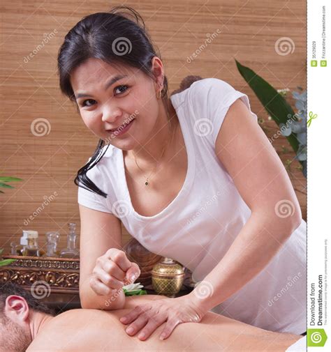 asian woman making massage to a man royalty free stock images image 35129029