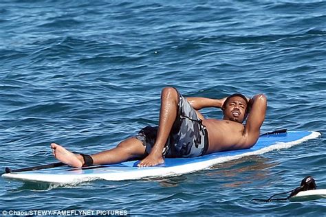 Michael B Jordan Takes Plunge While Paddleboarding In Maui