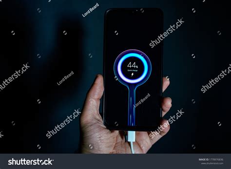 holding charging smartphone quick charge fast stock photo