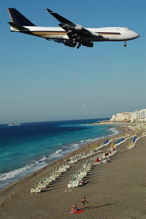 plane  beach stock photo image  close blue airliner