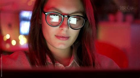 Woman With Glasses Looking At The Monitor By Stocksy Contributor