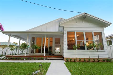 beautiful family home   full white exterior  wonderful lush