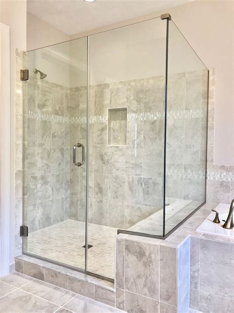 Clear Frameless Shower With Notched Inline Panel And Return Panel On