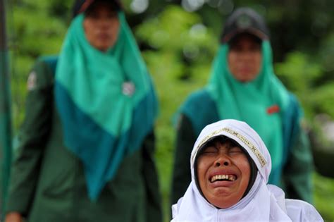 crowds cheer in indonesia as woman caned for hugging and kissing a man