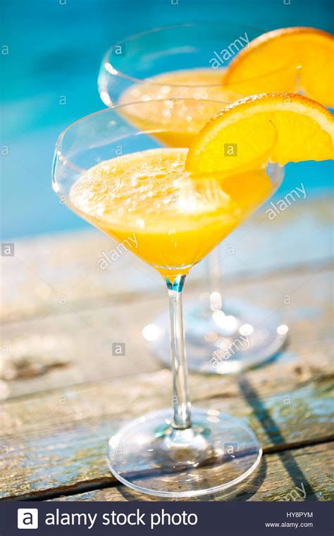 Champagne Glasses With Orange Slice Mimosa Cocktail